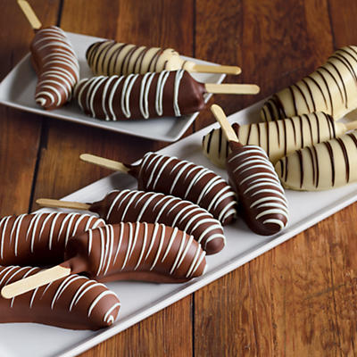 Though chocolate-covered bananas are a perennial summer favorite, these particular offerings are a gourmet sweet treat that's perfect for any month of the year. Each of these dozen frozen bananas is h