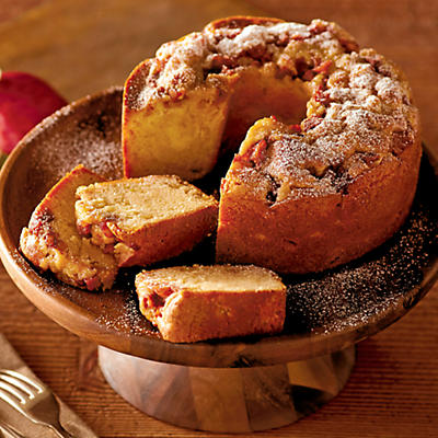 Apple Spice Cake, made right here in our bakery, is one of our favorite specialty cakes. Our bakers slice premium apples into a cinnamon and sugar mixture and bake them in moist vanilla batter, result
