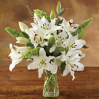 Our white lily bouquet is delivered fresh and blooming. An elegant bouquet of Oriental lilies, Bells of Ireland, and eucalyptus. These expertly grown, hand-gathered, and -assembled long-stemmed flower