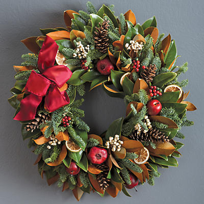 The Holiday Magnolia Wreath is handmade by family-owned and -operated Creekside Farms in California. Its rich colors make it perfect for a door wreath or wall wreath. The magnolia leaf and fir base is