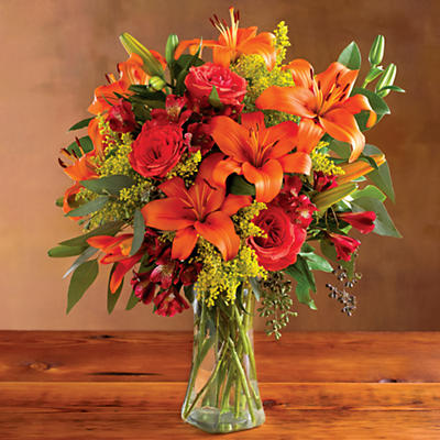 Crafted from handpicked flowers and herbs from the central coast of California, this beautiful Harvest Floral Bouquet is assembled by hand using fall Asiatic lilies, yellow solidago, roses, fall alstr