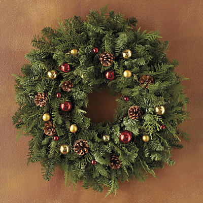 Handcrafted from boughs of cedar and fir, the fragrant Red and Gold Ornament Wreath comes from family-owned and -operated Creekside Farms of sunny Monterey County, California. Creekside Farms maintain